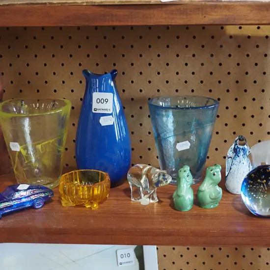 shelf of glassware - vases, paperweights, etc.