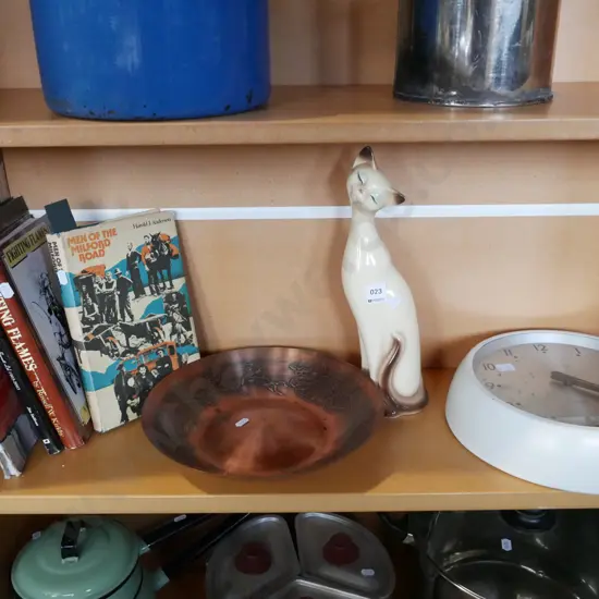 New Zealand books, copper bowl, cat figurine, wall clock