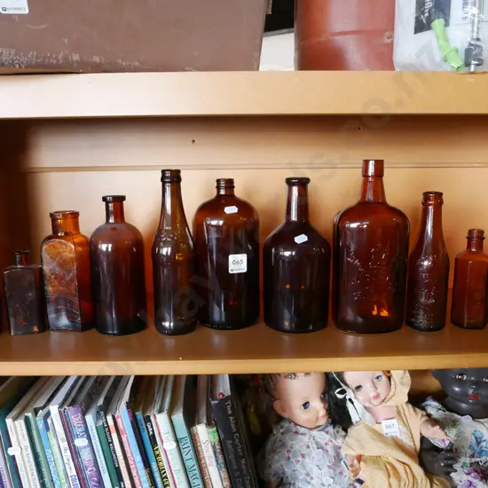 shelf of amber glass bottles