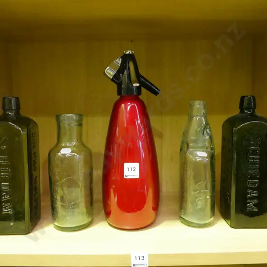 4 glass bottles and a soda syphon