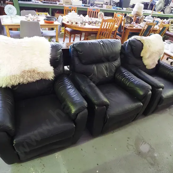 3 black vinyl upholstered reclining armchairs - some small rips and tears
