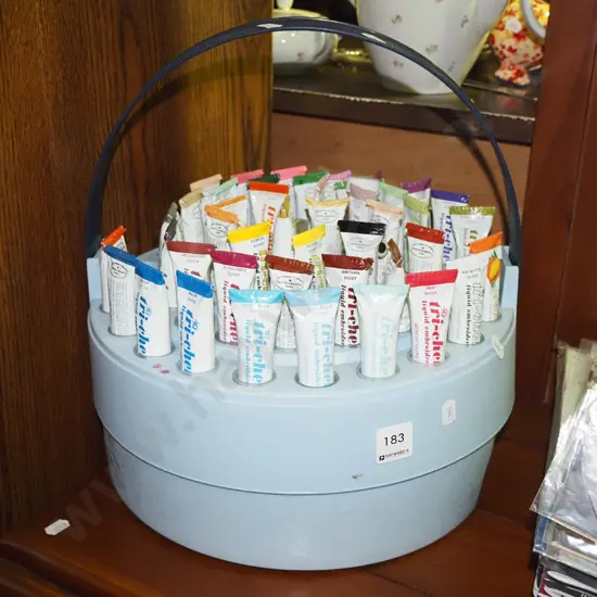 assorted fabric paints in portable plastic holder