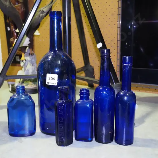 assorted blue glass bottles Tallest H-290