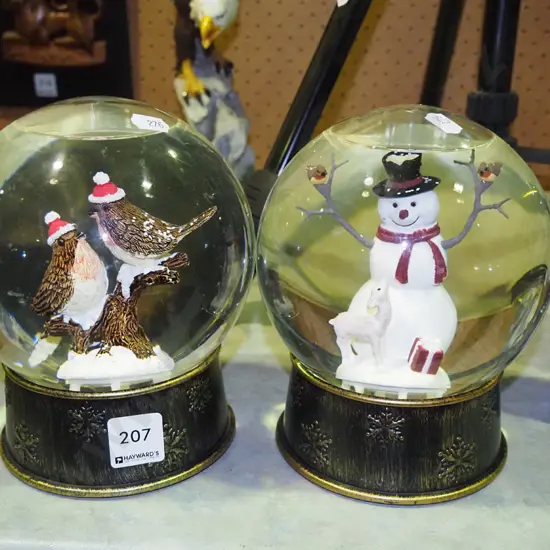 2 Christmas themed snow globes