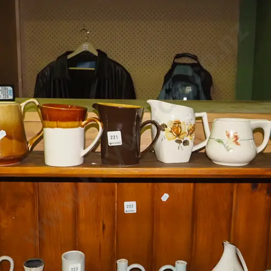 shelf of Crown Lynn jugs