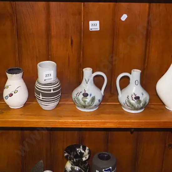 shelf of small vases