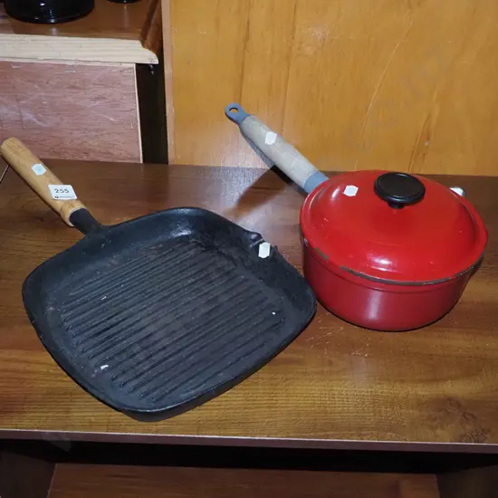 small cast-iron enamel sauce pan and a skillet
