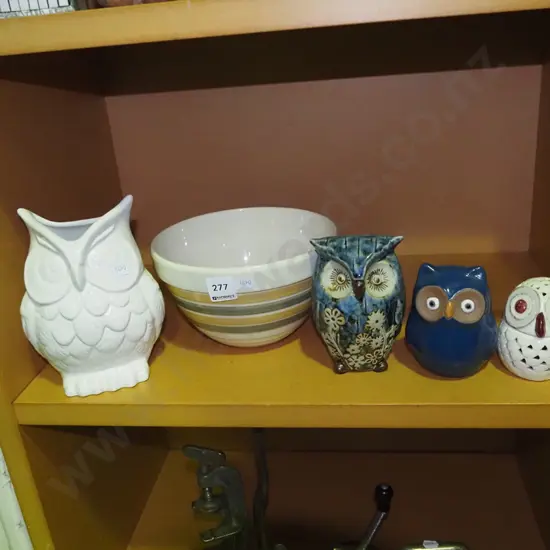 shelf of ornamental owls and a mixing bowl