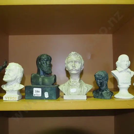 shelf of various busts and ornaments