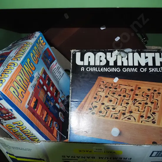 box of toy parking garage, wooden labyrinth game, backgammon game