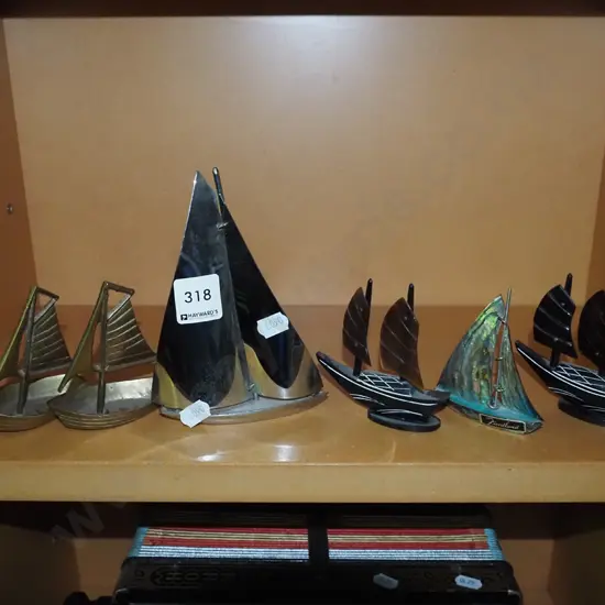 shelf of ornamental yachts