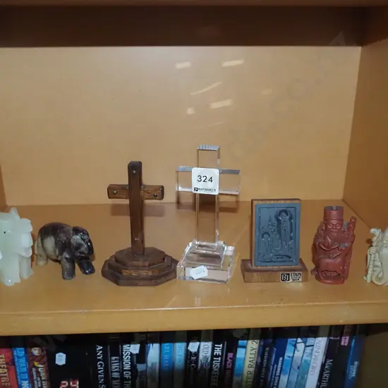 shelf: figurines, crucifixes etc.