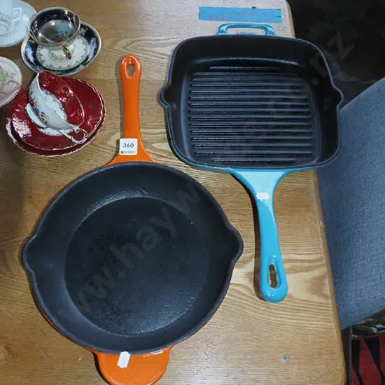 cast iron and enamel frying pan and a skillet