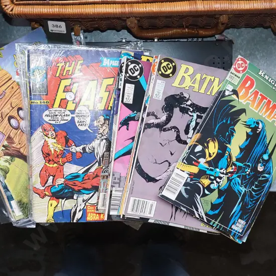 stack of various comic books