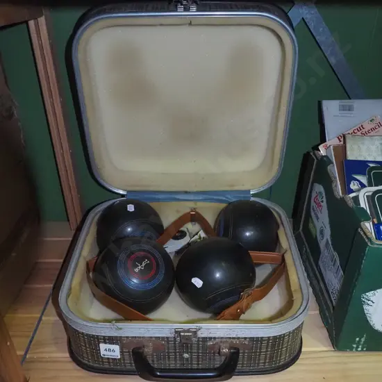 vintage lawn bowls in suitcase