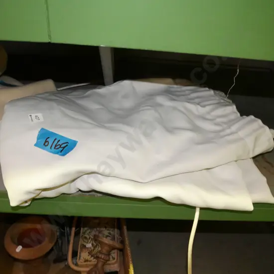 pair of white fabric curtains