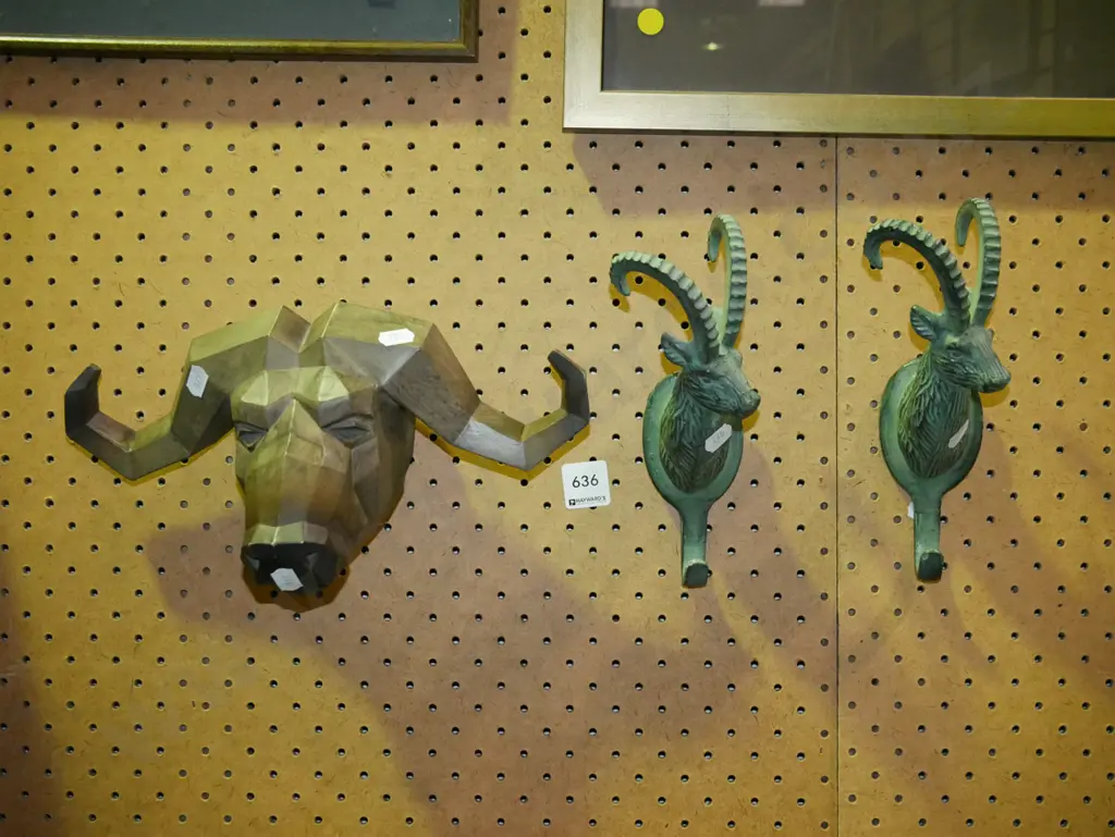 composite buffalo head and 2 cast metal taar themed coat hooks Image 1++