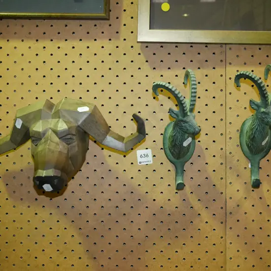 composite buffalo head and 2 cast metal taar themed coat hooks