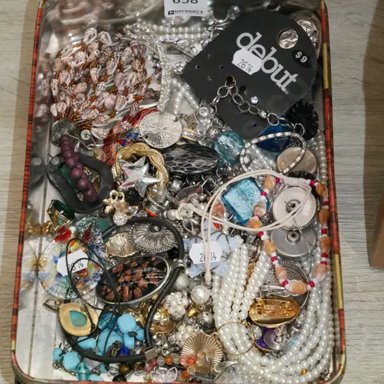 tin of costume jewellery