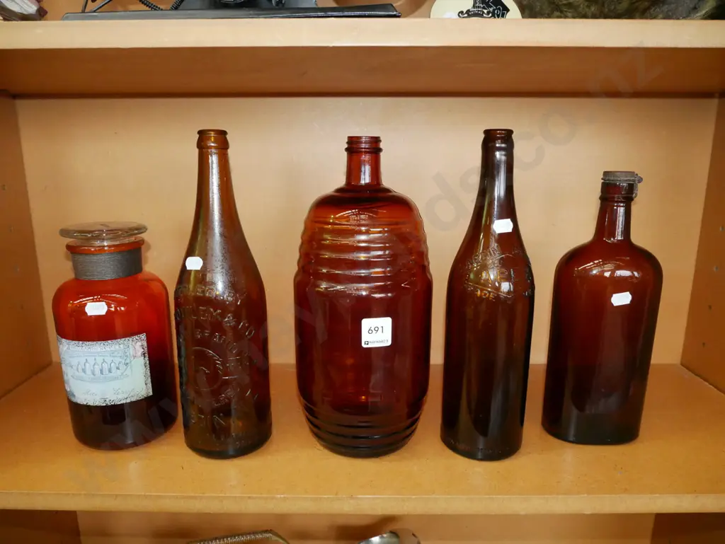 bay of brown glass bottles & storage canister Image 1++