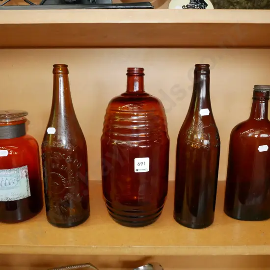 bay of brown glass bottles & storage canister