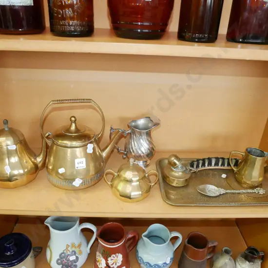 shelf, brass teapots, lidded sugar, jug, tray etc