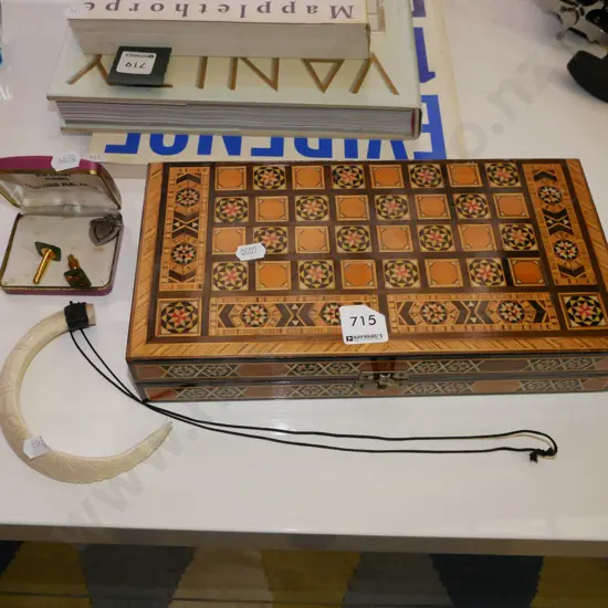 backgammon set, tusk necklace, cufflinks