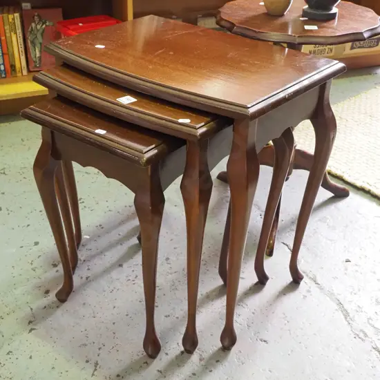 nest  of mahogany tables