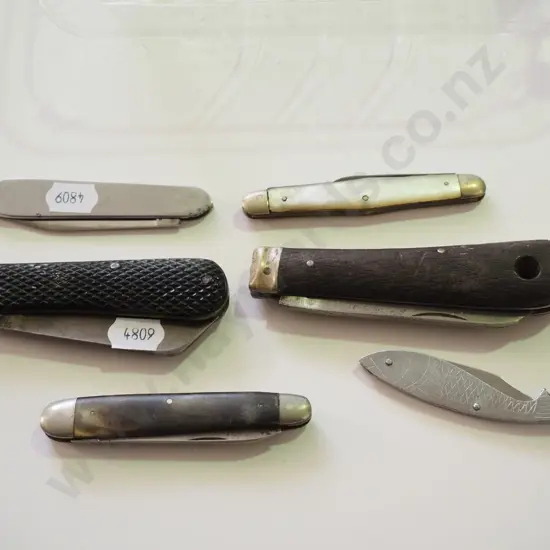 tray of pocket knives