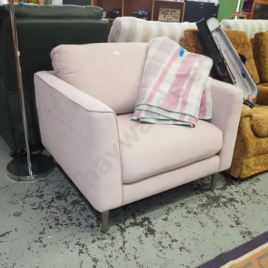 cream upholstered modern armchair