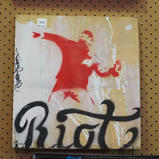 artwork on board - "Riot" street art