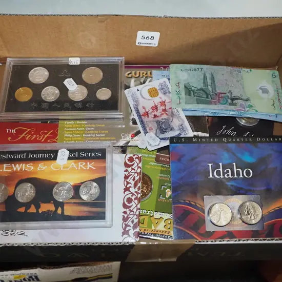 box of bank notes and collector coins
