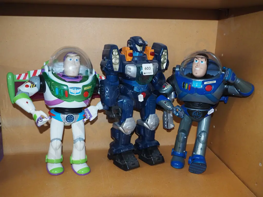 2x Buzz Light Year figurines, 1 other robot Image 1++