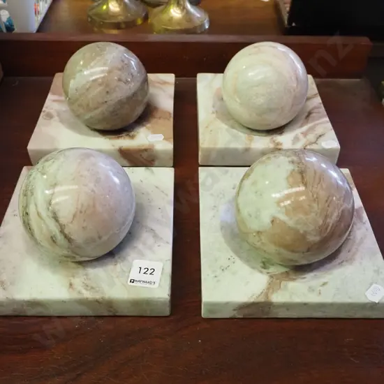 4x carved marble balls in concave dishes