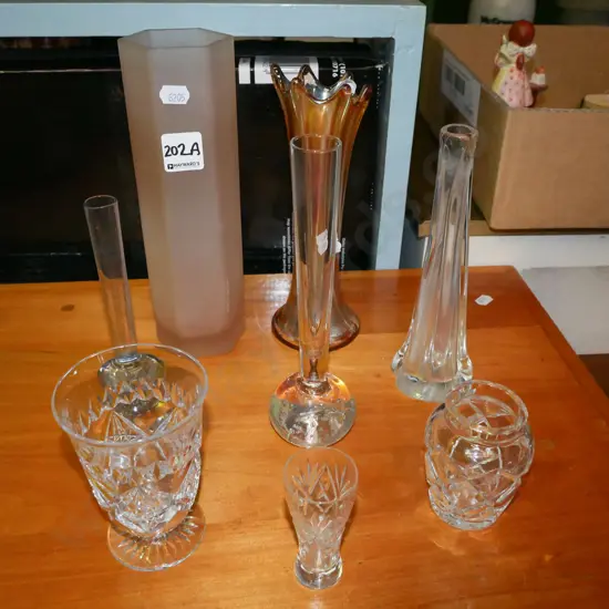 assorted glass and crystal vases