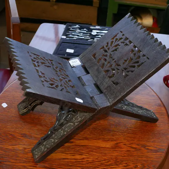 ornately carved book stand
