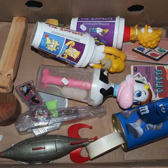 box; wooden train whistle, toy gun, Simpsons lidded drinking cups etc
