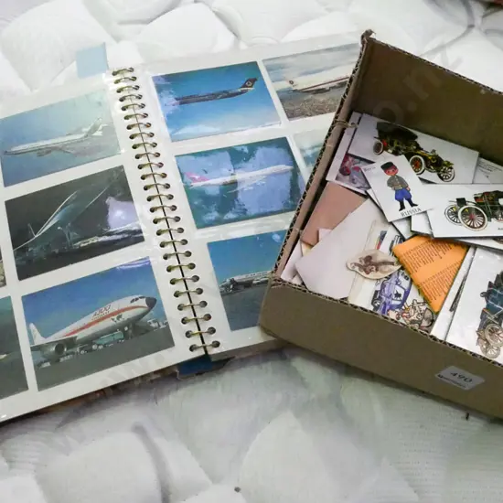 cat and dog figurines, collector card album, box of cards and plaques