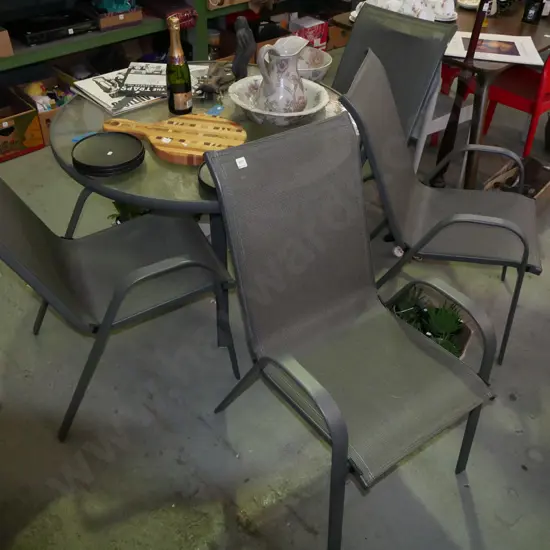 circular glass top and alloy patio table with 4 chairs - very good conditionn