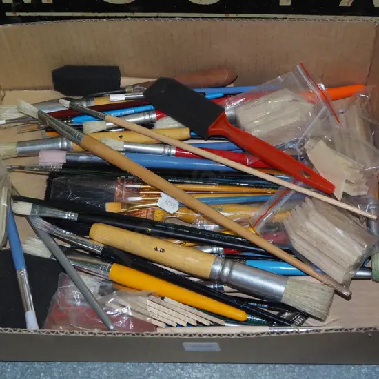 box of paint brushes and accessories