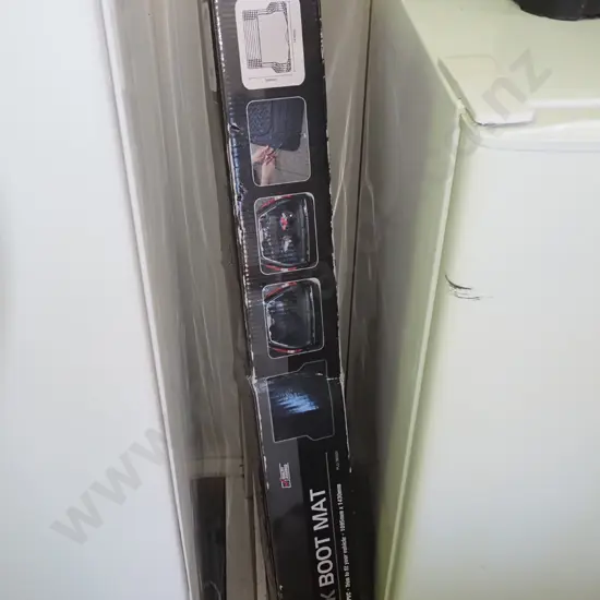 SCA black rubber boot mat in box