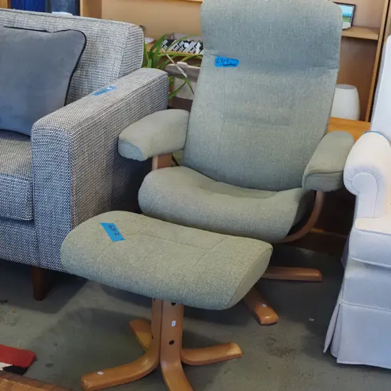 green Danish upholstered swivel reclining chair with footstool - some staining to fabric