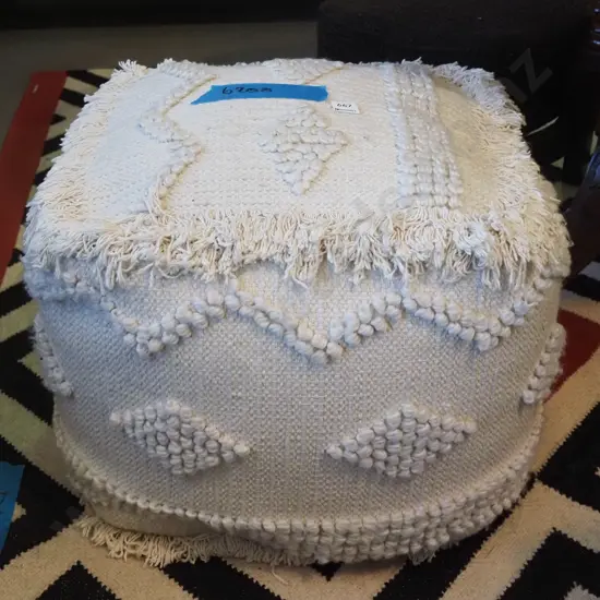 cream upholstered ottoman