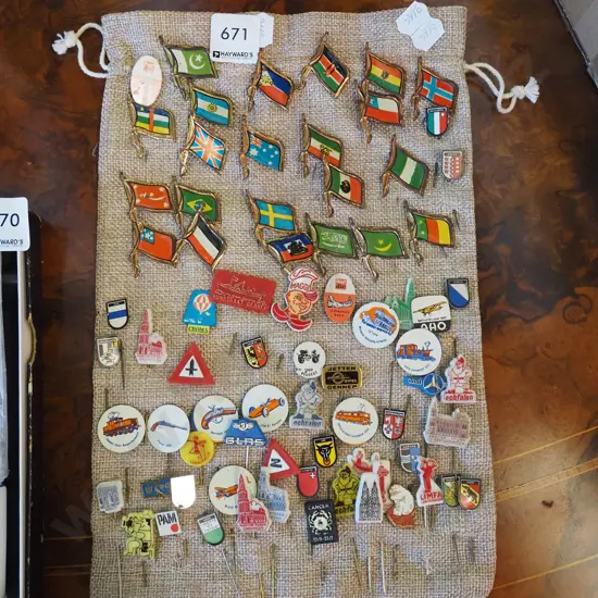 various tie pins and badges