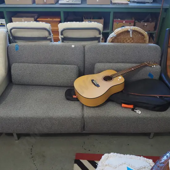 charcoal upolstered foldout double divan bed - some fading