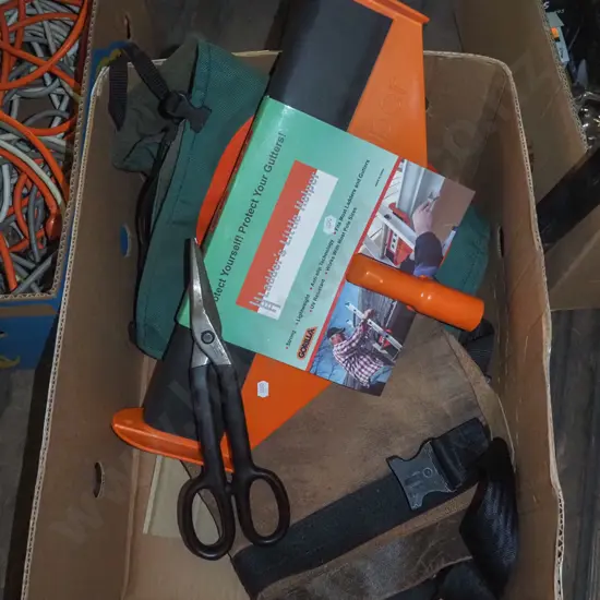 box; chainsaw chaps, ladder gutter guard, tin snips etc