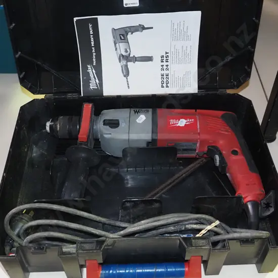 cased Milwaukee hammer drill