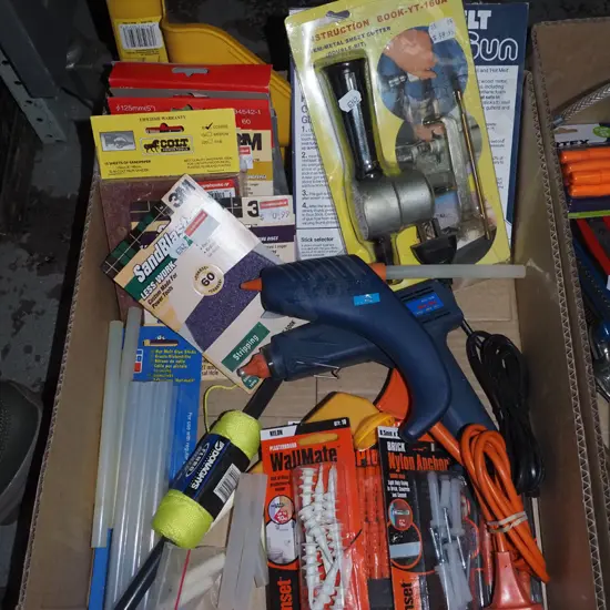 box; glue guns, builder's lines, sandpaper etc