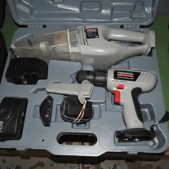 cased Predator battery powered tool set; drill hand held vacuum