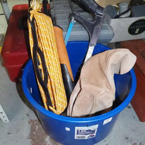 blue bucket of rope, hammer, hack saw, gloves